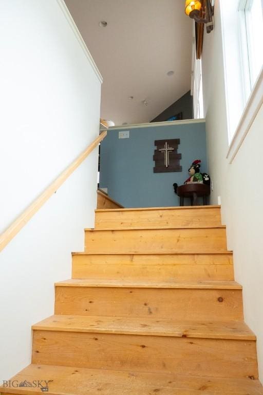 202 Beach Dr, West Yellowstone, MT 59758 - staircase featuring lofted ceiling