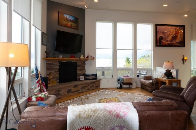 202 Beach Dr, West Yellowstone, MT 59758 - living room with a fireplace, recessed lighting, and wood finished floors