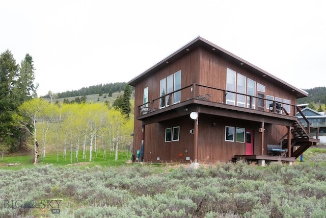 202 Beach Dr, West Yellowstone, MT 59758 - view of home's exterior featuring a wooden deck