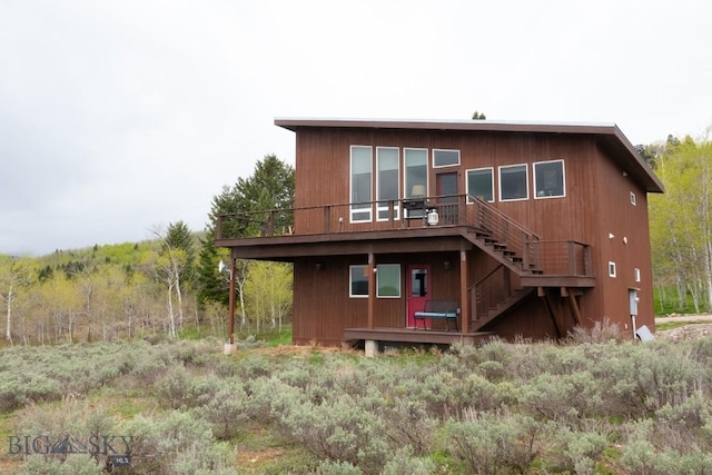 202 Beach Dr, West Yellowstone, MT 59758 - back of house featuring a deck and stairs