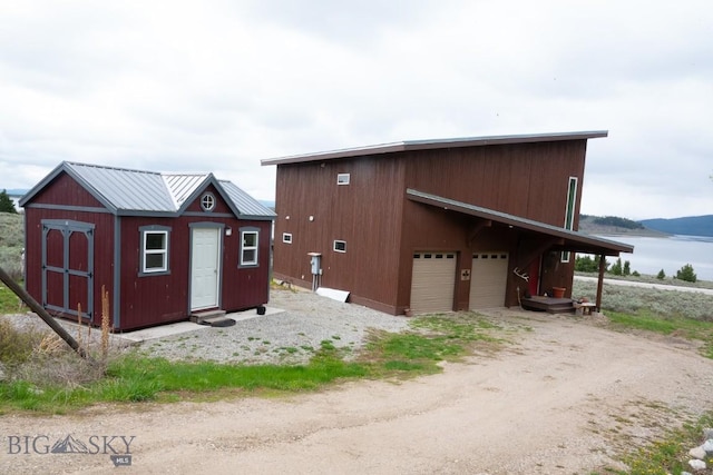 202 Beach Dr, West Yellowstone, MT 59758 - view of outbuilding featuring a water view
