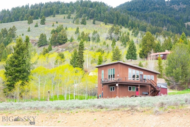 202 Beach Dr, West Yellowstone, MT 59758 - view of subject property featuring a heavily wooded area
