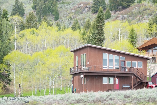 202 Beach Dr, West Yellowstone, MT 59758 - back of property featuring stairs and a deck