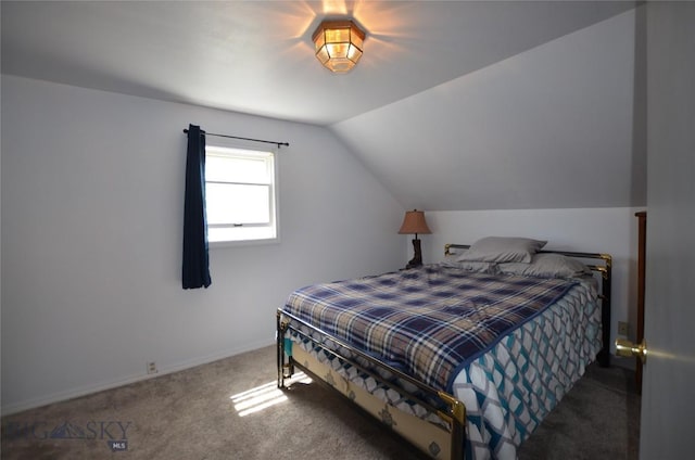 314 S Dakota St, Dillon, MT 59725 - bedroom featuring carpet floors, lofted ceiling, and baseboards