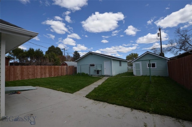 314 S Dakota St, Dillon, MT 59725 - back of property with an outdoor structure and a patio