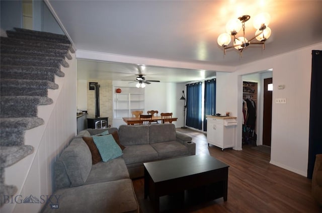 314 S Dakota St, Dillon, MT 59725 - living area with a chandelier, a wood stove, dark wood-type flooring, a ceiling fan, and baseboards