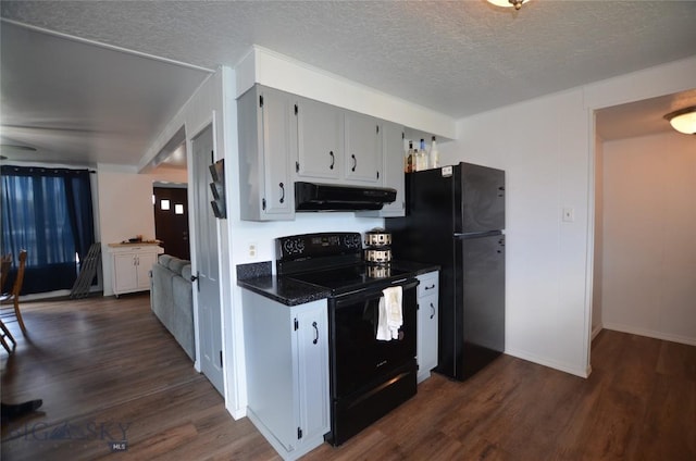 314 S Dakota St, Dillon, MT 59725 - kitchen with black appliances, under cabinet range hood, dark wood-style floors, ceiling fan, and a textured ceiling