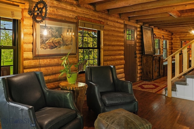 25 Big Chief Trl, Bozeman, MT 59718 - living area with rustic walls, hardwood / wood-style floors, stairway, and beamed ceiling