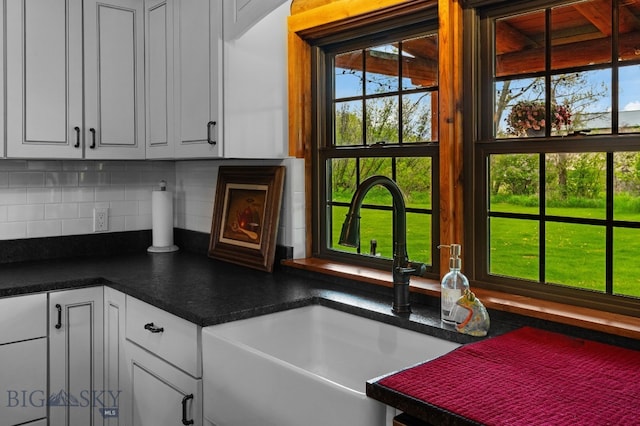 25 Big Chief Trl, Bozeman, MT 59718 - kitchen with decorative backsplash, white cabinets, and dark countertops