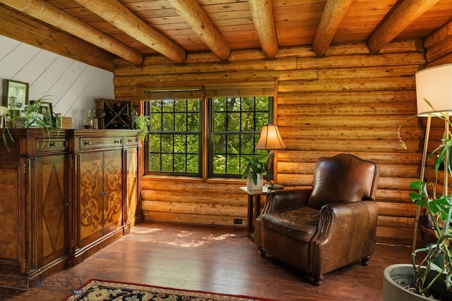 25 Big Chief Trl, Bozeman, MT 59718 - living area featuring a wood ceiling with exposed beams, dark wood-style floors, and log walls