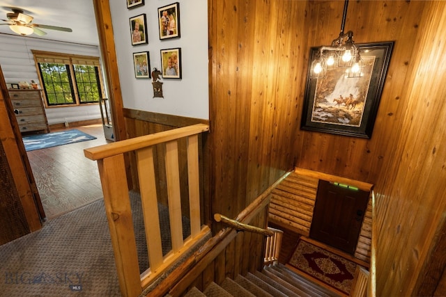 25 Big Chief Trl, Bozeman, MT 59718 - stairs with wooden walls, hardwood / wood-style floors, a ceiling fan, and a wainscoted wall