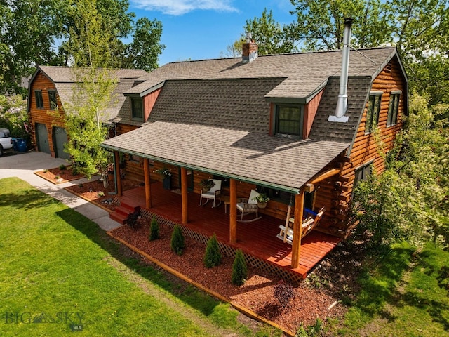 25 Big Chief Trl, Bozeman, MT 59718 - log cabin with a shingled roof, log exterior, a gambrel roof, and a front yard