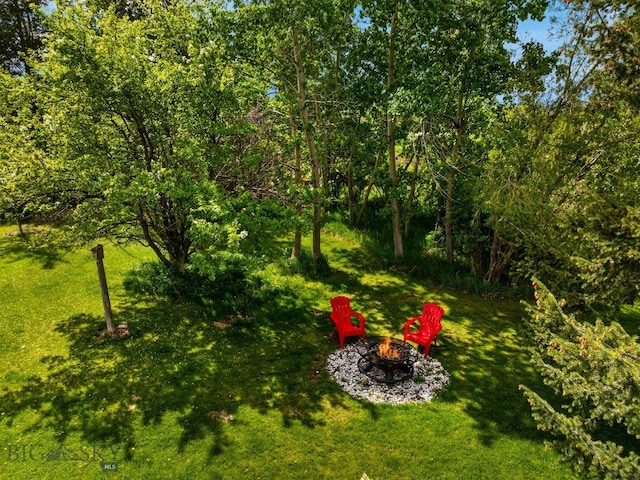 25 Big Chief Trl, Bozeman, MT 59718 - view of grassy yard featuring an outdoor fire pit