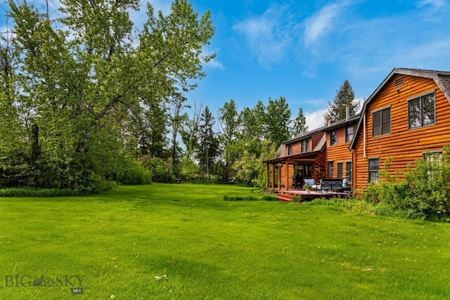 25 Big Chief Trl, Bozeman, MT 59718 - view of green lawn with a wooden deck