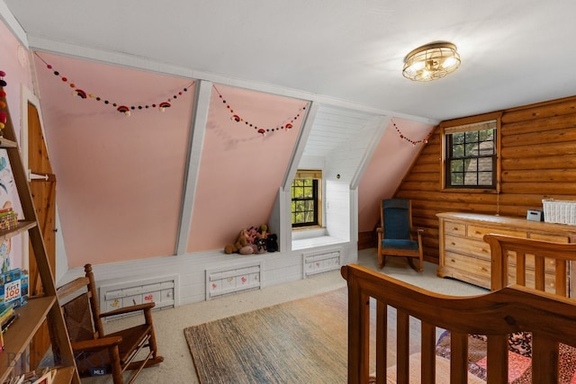 25 Big Chief Trl, Bozeman, MT 59718 - bedroom featuring rustic walls, lofted ceiling, and carpet