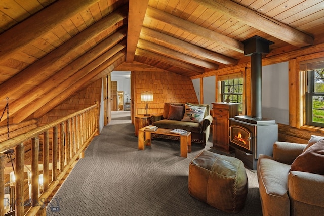 25 Big Chief Trl, Bozeman, MT 59718 - living area with a wood stove, dark carpet, and wooden ceiling