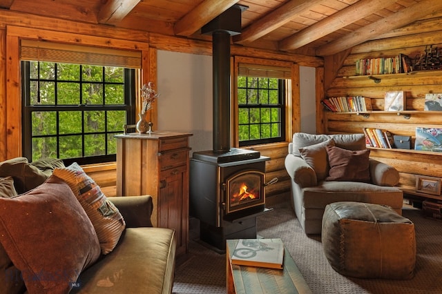 25 Big Chief Trl, Bozeman, MT 59718 - living area with a wood stove, plenty of natural light, log walls, wood ceiling, and wood finished floors