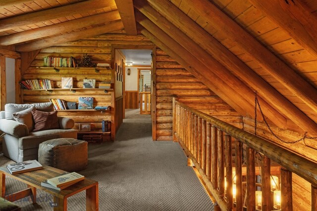 25 Big Chief Trl, Bozeman, MT 59718 - hallway featuring carpet, wood ceiling, log walls, and an upstairs landing