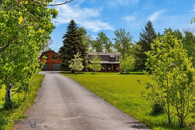 25 Big Chief Trl, Bozeman, MT 59718 - view of front of property with a front lawn, a garage, and driveway