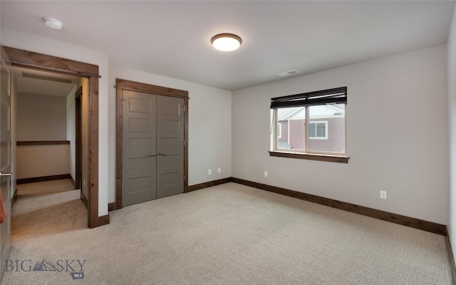 1304 Glider Ln Unit B, Belgrade, MT 59714 - unfurnished bedroom featuring light colored carpet and baseboards
