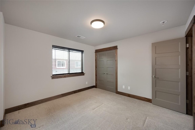 1304 Glider Ln Unit B, Belgrade, MT 59714 - unfurnished bedroom with carpet, baseboards, and a closet