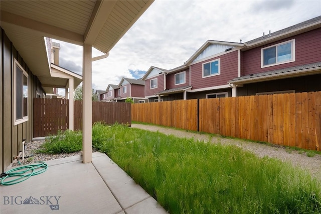 1304 Glider Ln Unit B, Belgrade, MT 59714 - view of yard with a patio area and a residential view