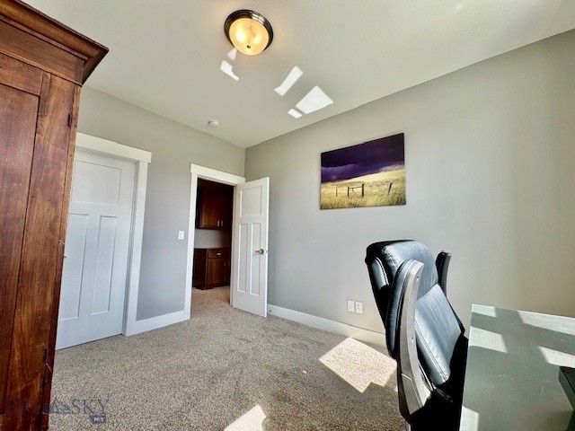 920 Butler Creek Ave, Belgrade, MT 59714 - office area featuring light carpet and baseboards