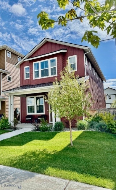 920 Butler Creek Ave, Belgrade, MT 59714 - view of front of property featuring a front lawn and board and batten siding