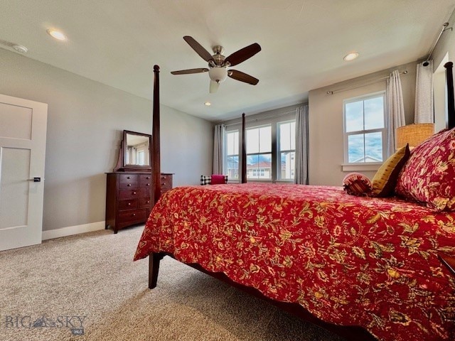 920 Butler Creek Ave, Belgrade, MT 59714 - bedroom with multiple windows, recessed lighting, carpet floors, a ceiling fan, and baseboards