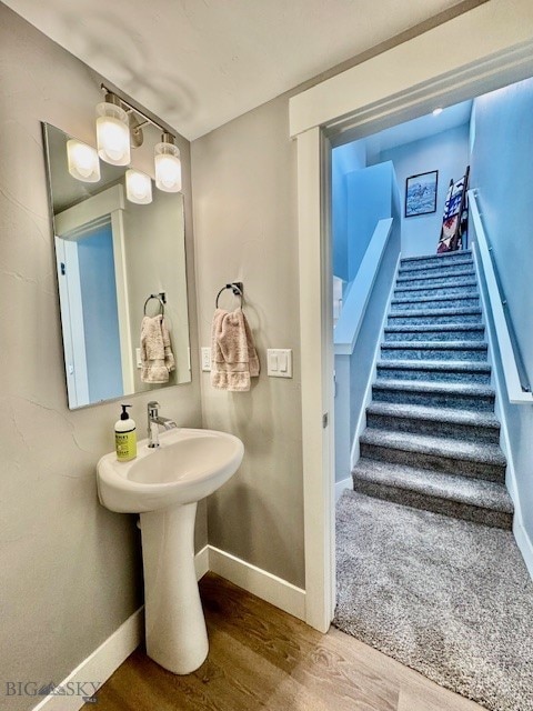 920 Butler Creek Ave, Belgrade, MT 59714 - bathroom featuring wood finished floors and baseboards