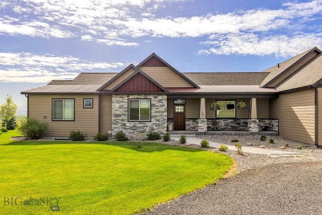 43 Lewis Dr, Three Forks, MT 59752 - craftsman-style home featuring covered porch, board and batten siding, a front yard, and roof with shingles