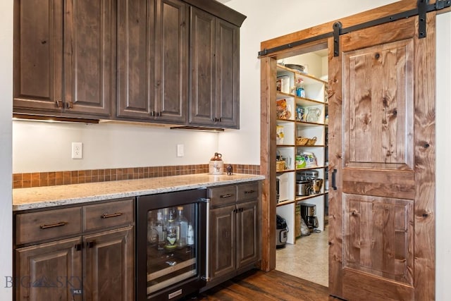 43 Lewis Dr, Three Forks, MT 59752 - indoor dry bar with beverage cooler and a barn door