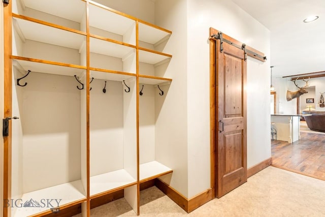 43 Lewis Dr, Three Forks, MT 59752 - mudroom with a barn door, recessed lighting, baseboards, and carpet flooring