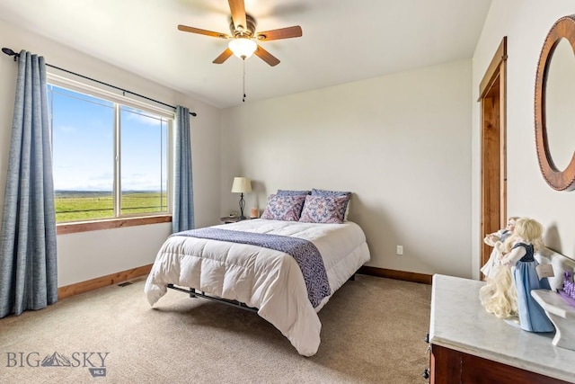 43 Lewis Dr, Three Forks, MT 59752 - bedroom with baseboards, light carpet, and a ceiling fan