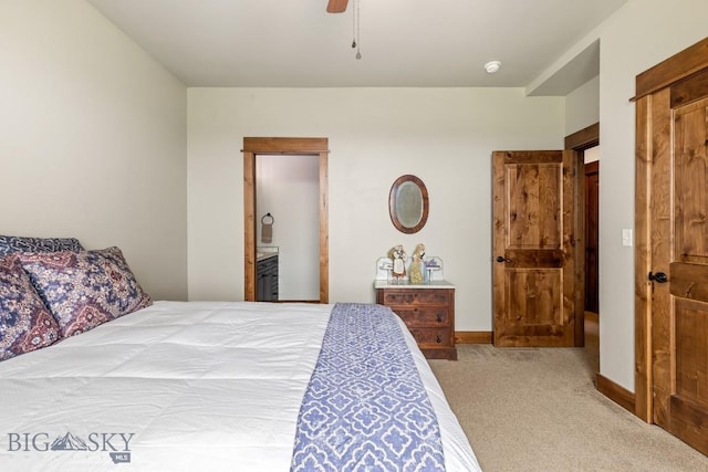 43 Lewis Dr, Three Forks, MT 59752 - bedroom featuring carpet, baseboards, a ceiling fan, and connected bathroom
