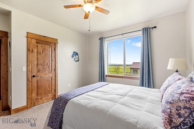 43 Lewis Dr, Three Forks, MT 59752 - carpeted bedroom with baseboards and a ceiling fan
