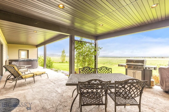 43 Lewis Dr, Three Forks, MT 59752 - view of patio / terrace featuring a hot tub, outdoor dining space, and a view of rural / pastoral area