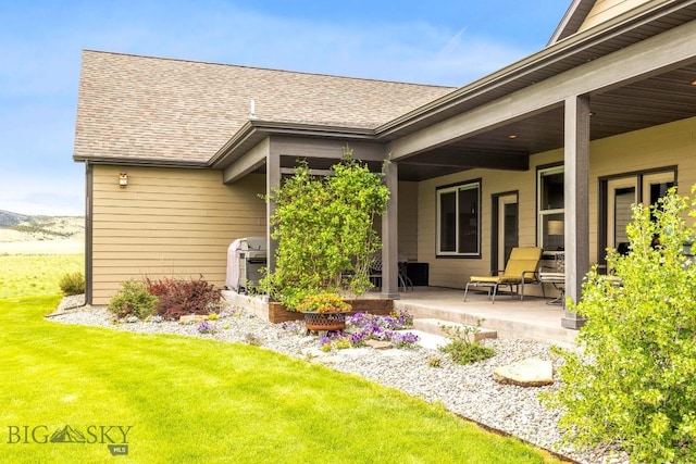 43 Lewis Dr, Three Forks, MT 59752 - back of property featuring a shingled roof and a yard