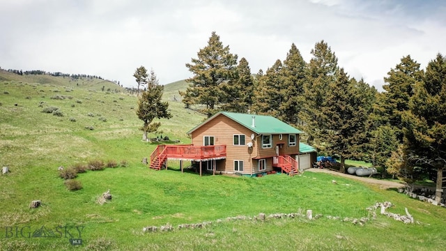 263 Hercules Rd, Emigrant, MT 59027 - back of house featuring stairs, a deck, and a yard