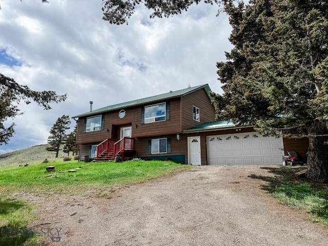 263 Hercules Rd, Emigrant, MT 59027 - bi-level home featuring driveway, an attached garage, and metal roof