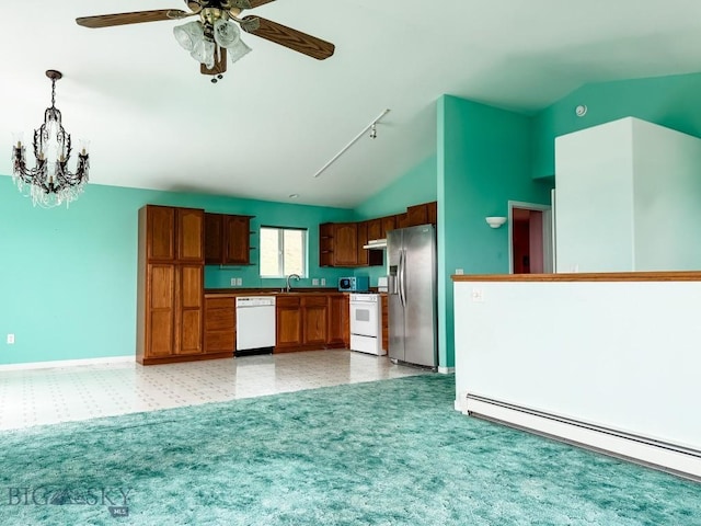 263 Hercules Rd, Emigrant, MT 59027 - kitchen with white appliances, lofted ceiling, a baseboard radiator, a chandelier, and a sink