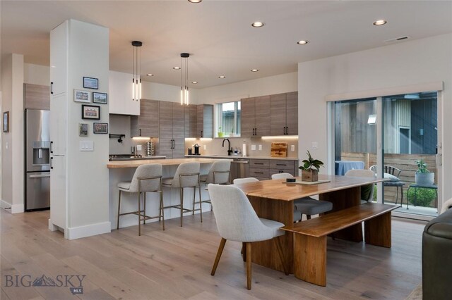 1510 Windrow Dr, Bozeman, MT 59718 - dining space featuring recessed lighting, light wood-style floors, and baseboards