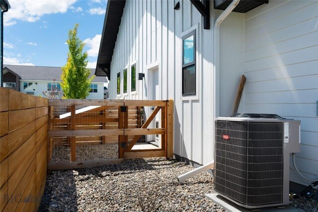 1510 Windrow Dr, Bozeman, MT 59718 - view of side of property featuring central air condition unit and board and batten siding