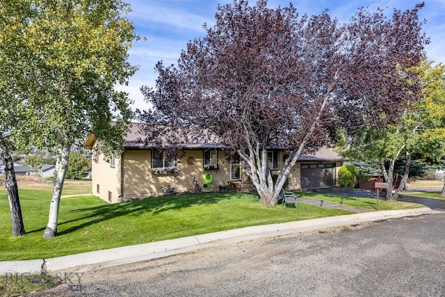 34 Mammoth, Butte, MT 59701 - view of front facade featuring asphalt driveway, a front lawn, and an attached garage