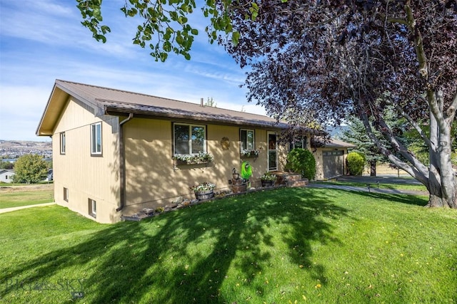 34 Mammoth, Butte, MT 59701 - ranch-style home with a front yard, metal roof, and a garage