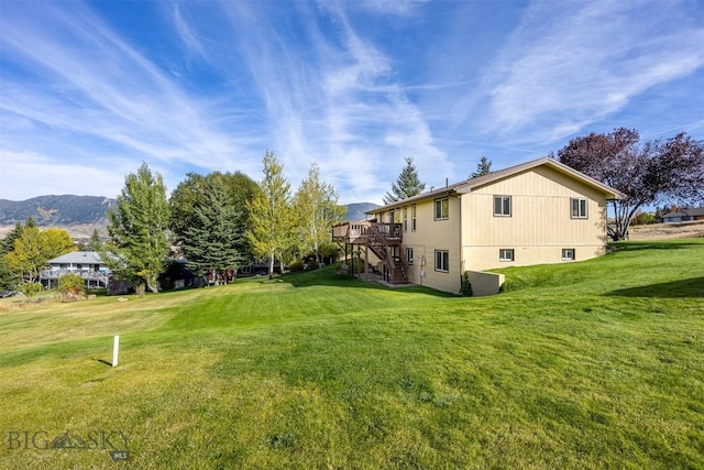 34 Mammoth, Butte, MT 59701 - view of grassy yard featuring stairs and a deck with mountain view