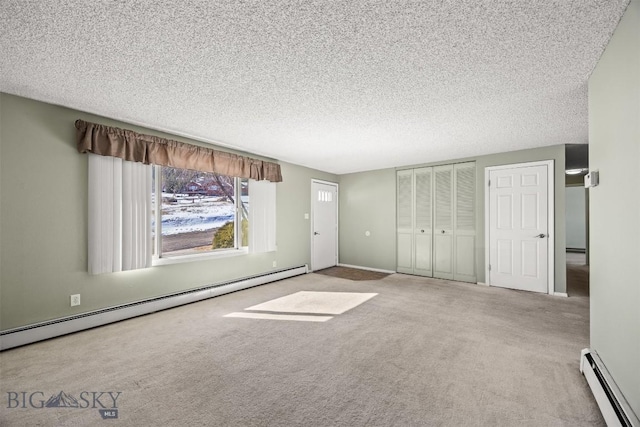 34 Mammoth, Butte, MT 59701 - entrance foyer featuring baseboard heating, carpet floors, and a textured ceiling