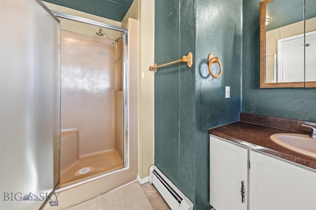 34 Mammoth, Butte, MT 59701 - bathroom with baseboard heating, a stall shower, vanity, tile patterned flooring, and a textured wall