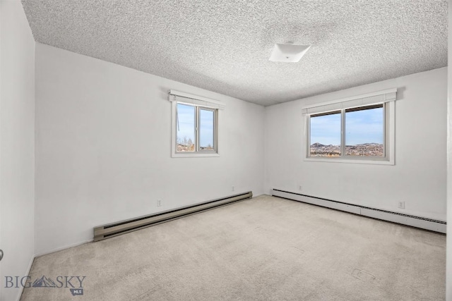 34 Mammoth, Butte, MT 59701 - carpeted spare room with a baseboard radiator and a textured ceiling