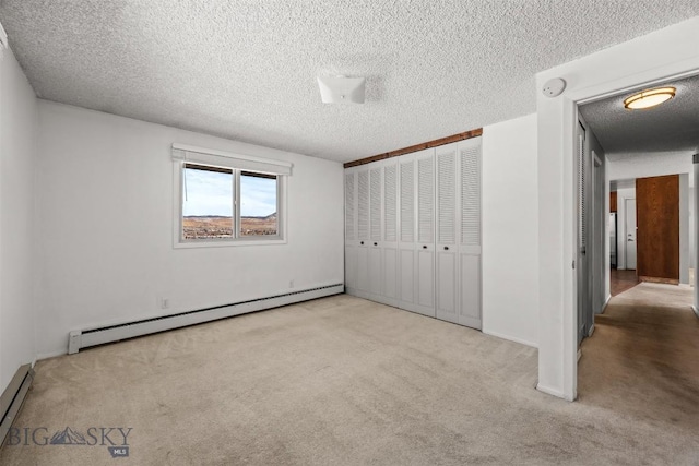 34 Mammoth, Butte, MT 59701 - unfurnished bedroom with a baseboard radiator, carpet flooring, a textured ceiling, a baseboard heating unit, and a closet